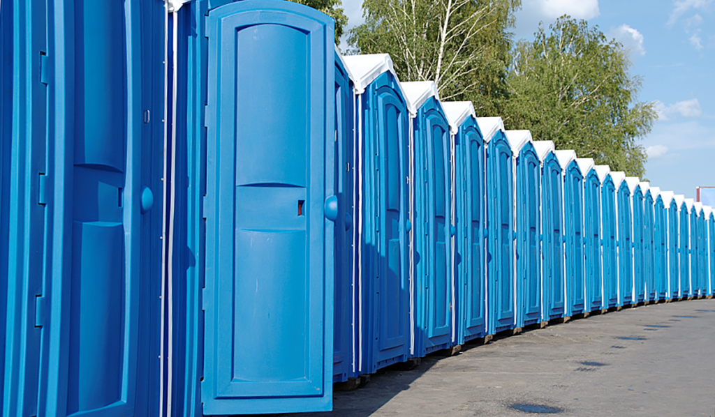 A row of blue portable toilets
