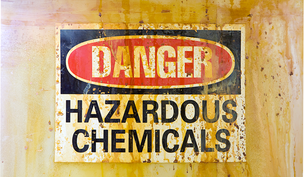 A close-up of a danger hazardous chemicals warning label